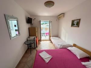 Postelja oz. postelje v sobi nastanitve Apartmani Vukcevic