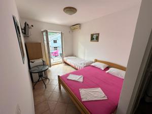 Postelja oz. postelje v sobi nastanitve Apartmani Vukcevic