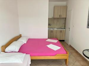 Postelja oz. postelje v sobi nastanitve Apartmani Vukcevic