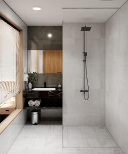 W łazience znajduje się prysznic i umywalka. w obiekcie River Way Hotel w Ha Long