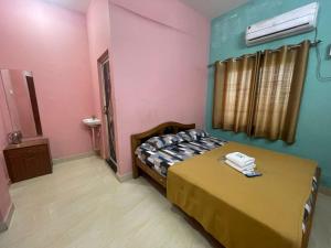 A bed or beds in a room at sudhara Residecy