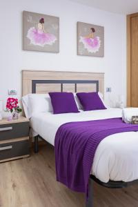 Cama o camas de una habitación en Alojamientos Rías Baixas-Casa Lisi-Ribeira