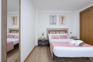 Cama o camas de una habitación en Alojamientos Rías Baixas-Casa Lisi-Ribeira