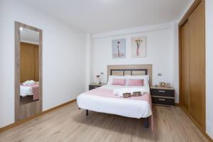 Cama o camas de una habitación en Alojamientos Rías Baixas-Casa Lisi-Ribeira