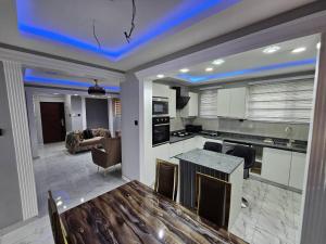 a kitchen and living room with a table and chairs at CASA BONCUORE in Tema