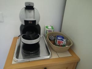a coffee maker sitting on top of a wooden shelf at Ape Regina agriturismo 2 Montelarco in Rignano Flaminio