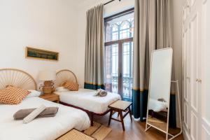 En eller flere senge i et værelse på AoA Plaza Nueva Luxury + 14 billeder