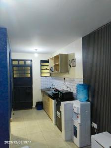 Dapur atau dapur kecil di Kigemti Home