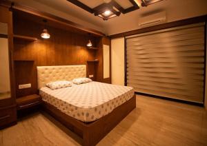 a bedroom with a bed in a room at Luxury Hill Top Apartment by EWA Properties in Mangalore