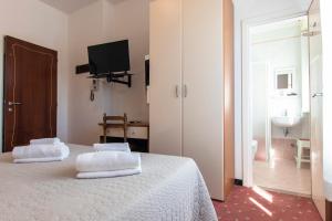 Postel nebo postele na pokoji v ubytování Villa Liberty Versilia