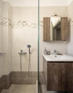 a bathroom with a shower and a sink at MESSARIA APARTMENt in Mesaria +21 photos