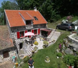 a man standing in front of a house at un petit coin paisible et frais - piscine à 3 mins in Le Monteil +7 photos