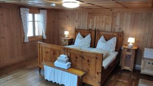 a bedroom with a bed and two night stands at Zom Ruaba in Bartholomäberg