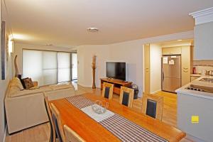 a kitchen and a living room with a table at Lesueur Days in Jurien Bay