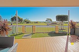 an open deck with a view of a park at Lesueur Days in Jurien Bay