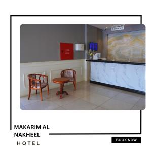 a waiting room with two chairs and a counter at Makarim Palm Hotel in Rabigh