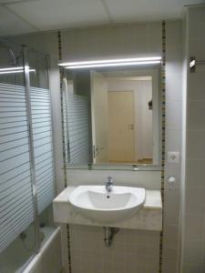 a bathroom with a sink and a mirror at Plaza Mayor in Calpe