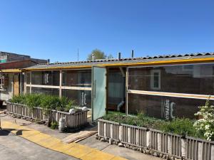 a building with a bunch of plants in front of it at Gana's Guest House and Tours in Ulaanbaatar
