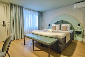 Postel nebo postele na pokoji v ubytování Hotel Halbert