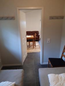 a room with a living room and a dining room at - Schönes kleines Apartment zum Schlafen - in Moholm