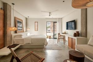 Postel nebo postele na pokoji v ubytování The Tryst Puerto Vallarta LGBT Hotel + 11 fotografií