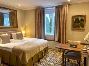 Postel nebo postele na pokoji v ubytování Sockerslottet Hotell