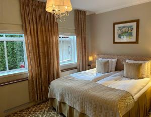 Postel nebo postele na pokoji v ubytování Sockerslottet Hotell