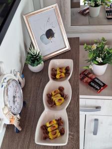 a table with a plate of food and a clock at Kućica na Drini "JAZ" in Višegrad +10 photos
