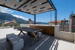 a picnic table on the roof of a building at OVILIO KALAMATA in Kalamata