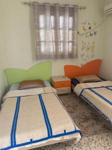 En eller flere senge i et værelse på Dar kouka
