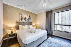 Postel nebo postele na pokoji v ubytování Jumeirah Beach Residence, Dubai Marina
