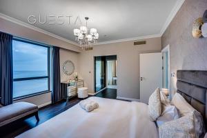 Postel nebo postele na pokoji v ubytování Jumeirah Beach Residence, Dubai Marina