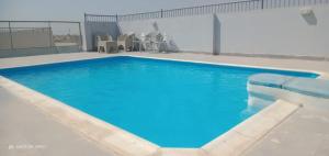 a large swimming pool on top of a building at luxury house in Cairo
