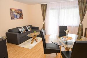 a living room with a couch and a glass table at Palma in Jajce