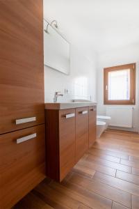 a bathroom with a sink and a toilet at Albergo Diffuso Magredi in Vivaro