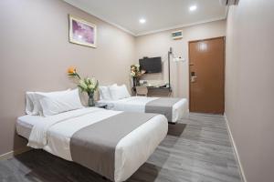 Postel nebo postele na pokoji v ubytování HOTEL 28 RAPID
