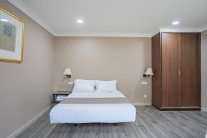 Postel nebo postele na pokoji v ubytování HOTEL 28 RAPID