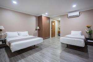 Postel nebo postele na pokoji v ubytování HOTEL 28 RAPID
