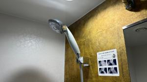 a shower in the corner of a room at Kyoto Yamashina Hotel Sanraku in Kyoto