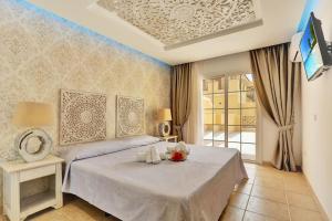 Ένα ή περισσότερα κρεβάτια σε δωμάτιο στο Luxury House Granada Park +17 φωτογραφίες