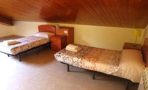 Posteľ alebo postele v izbe v ubytovaní apartament dúplex "Alsina"
