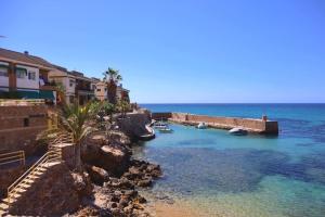 a group of boats in a body of water at Grande corner villa in Isla Plana by the sea in Isla Plana
