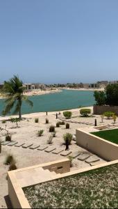 a view of a beach with a body of water at Lake View Luxury Suite, Hawana Resort in Salalah