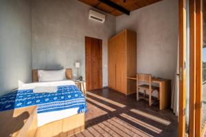 Postel nebo postele na pokoji v ubytování MASMARA Resort Canggu