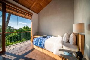 Postel nebo postele na pokoji v ubytování MASMARA Resort Canggu