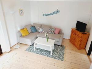 a living room with a couch and a table at Mandulás nyaraló in Zánka