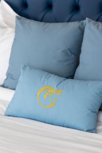 A bed or beds in a room at THE OSiRiS
