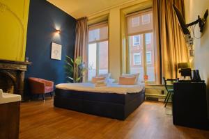 Postel nebo postele na pokoji v ubytování Hotel Corps de Garde