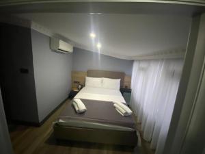 Postel nebo postele na pokoji v ubytování Sirkeci Esen Apart