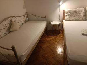 Postel nebo postele na pokoji v ubytování Rooms & Apartments Linda & Mario
